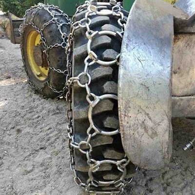Forestry Tire working in field with chain